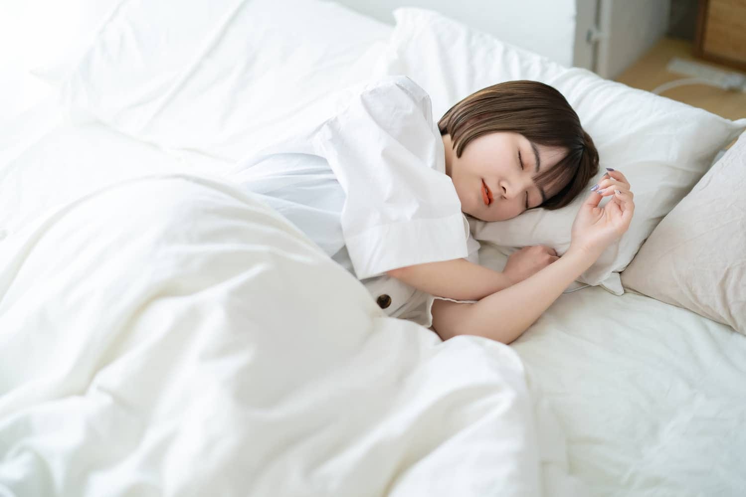 female sleeping on a bed