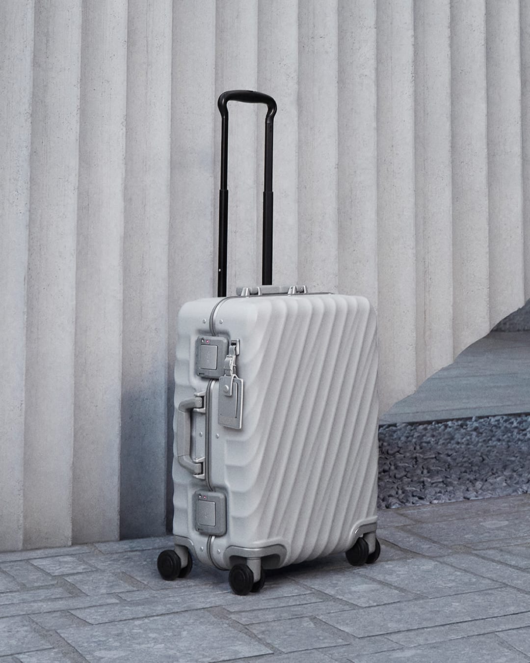 tumi fall 2024 collection mun ka young 19 degree frame international 4 wheeled carry on in pearl grey texture