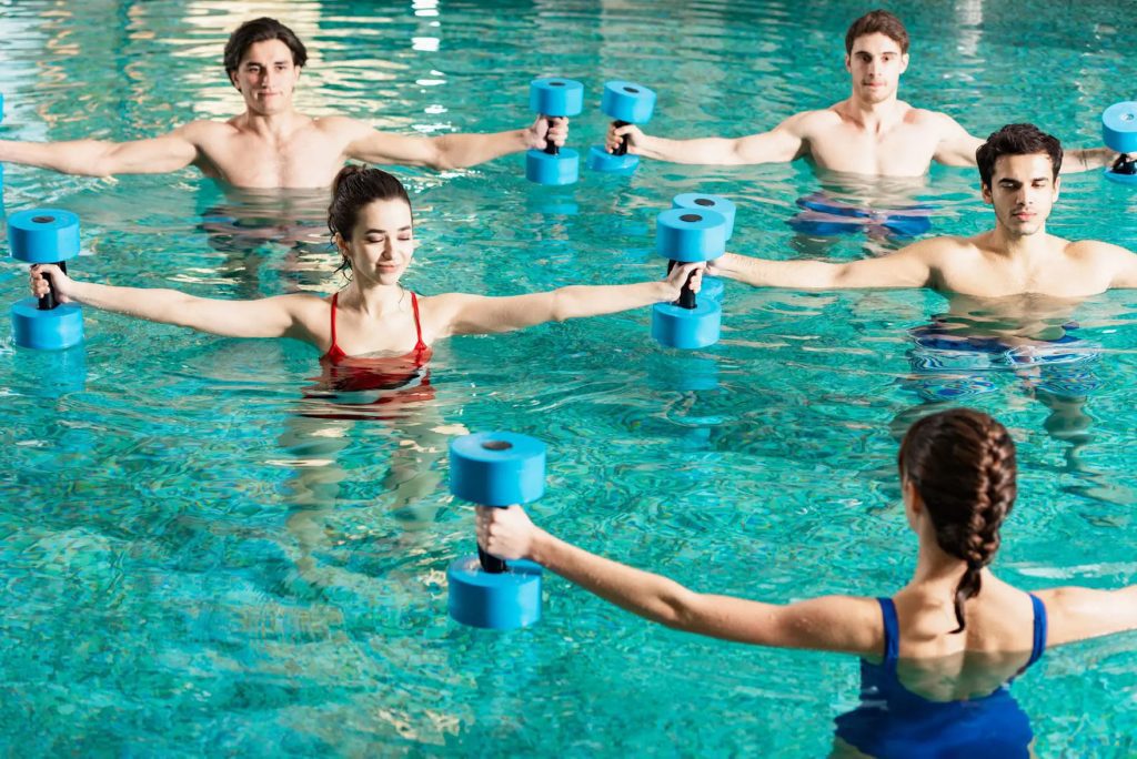 trainer holding barbells while exercising with gro 2023 11 27 04 51 13 utc 02