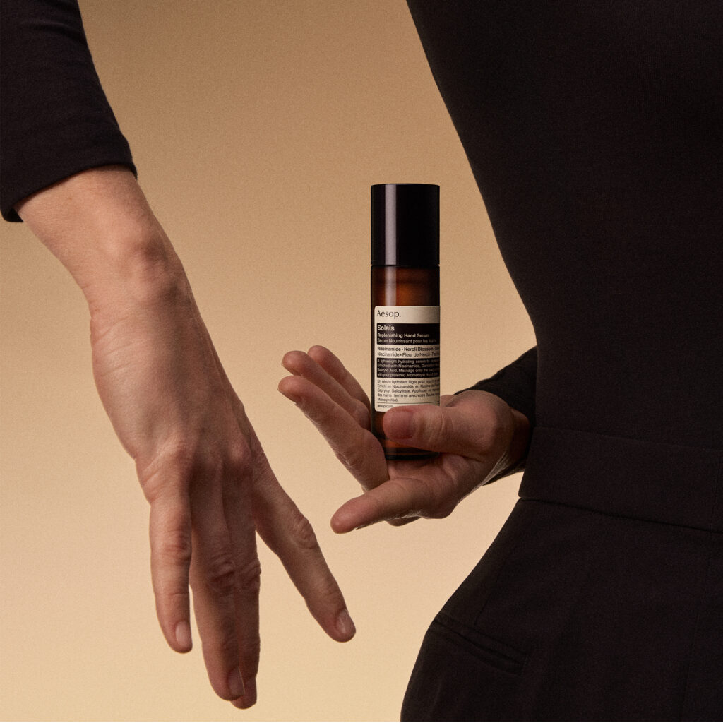 aesop solais replenishing hand serum model shot 15